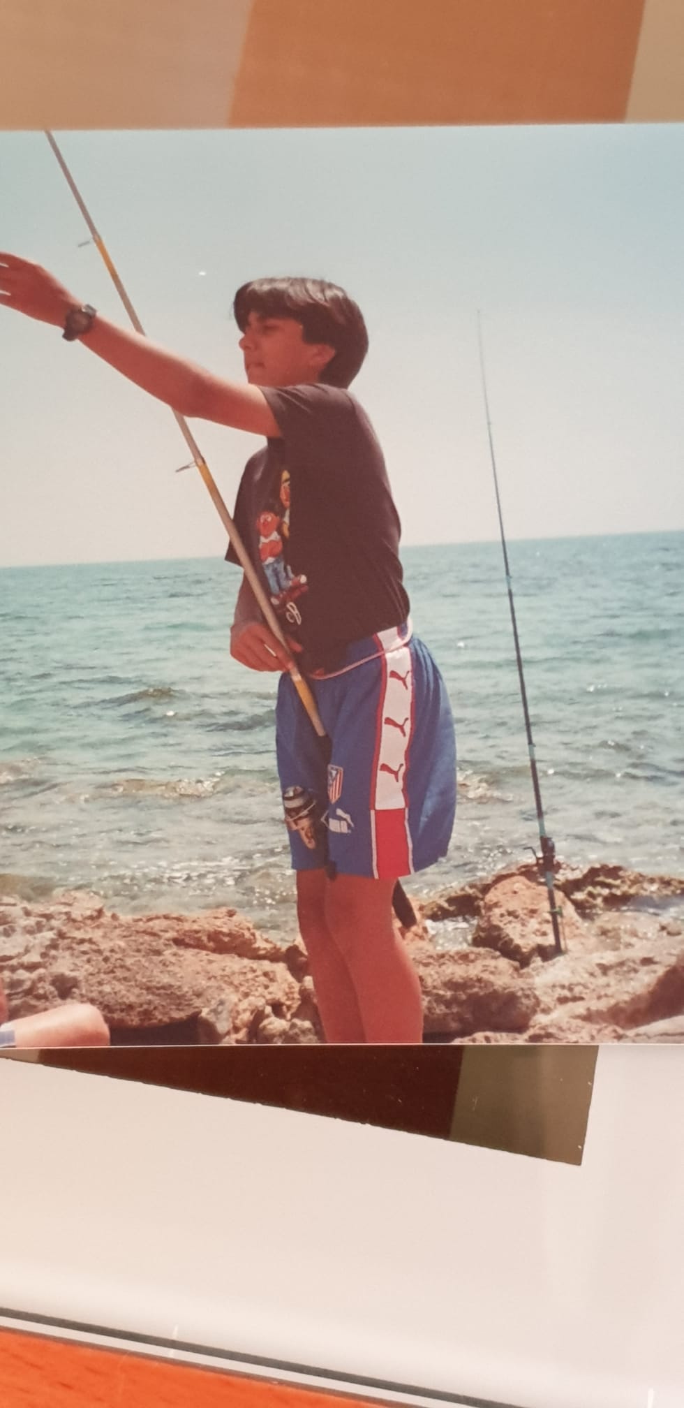 Raul fishing as a child in Spain